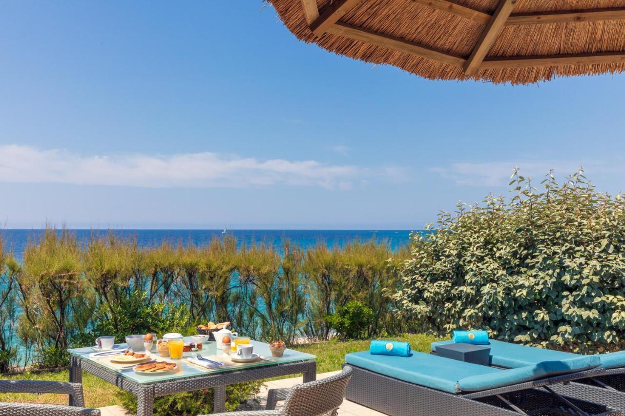 Hotel Le Ruesco Ольмето Экстерьер фото